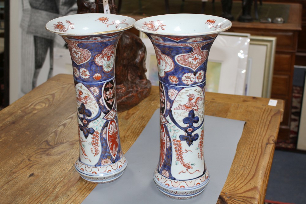 A near pair of Imari trumpet vases, decorated with birds and flowers, height 39.5cm